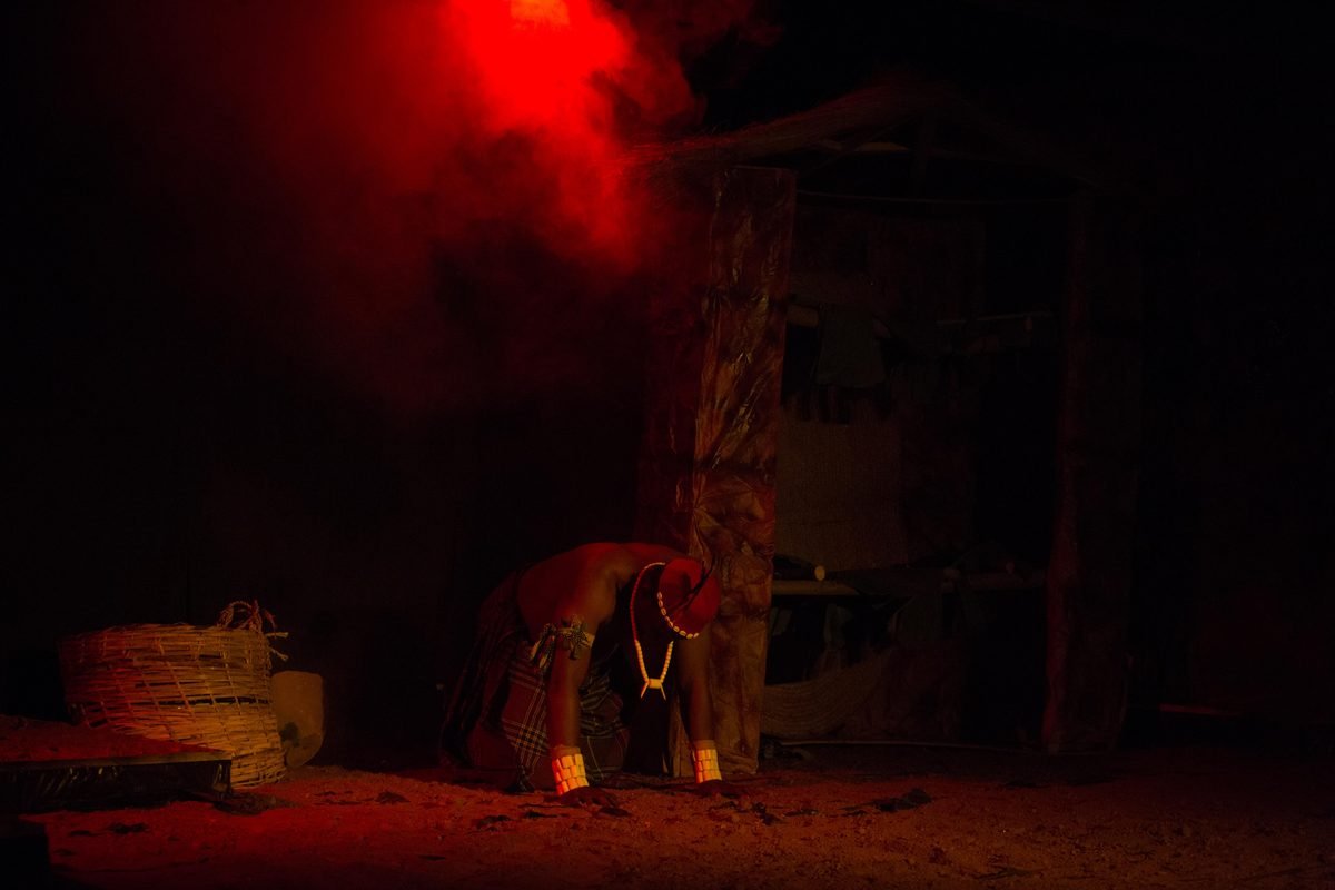 A performer under red light